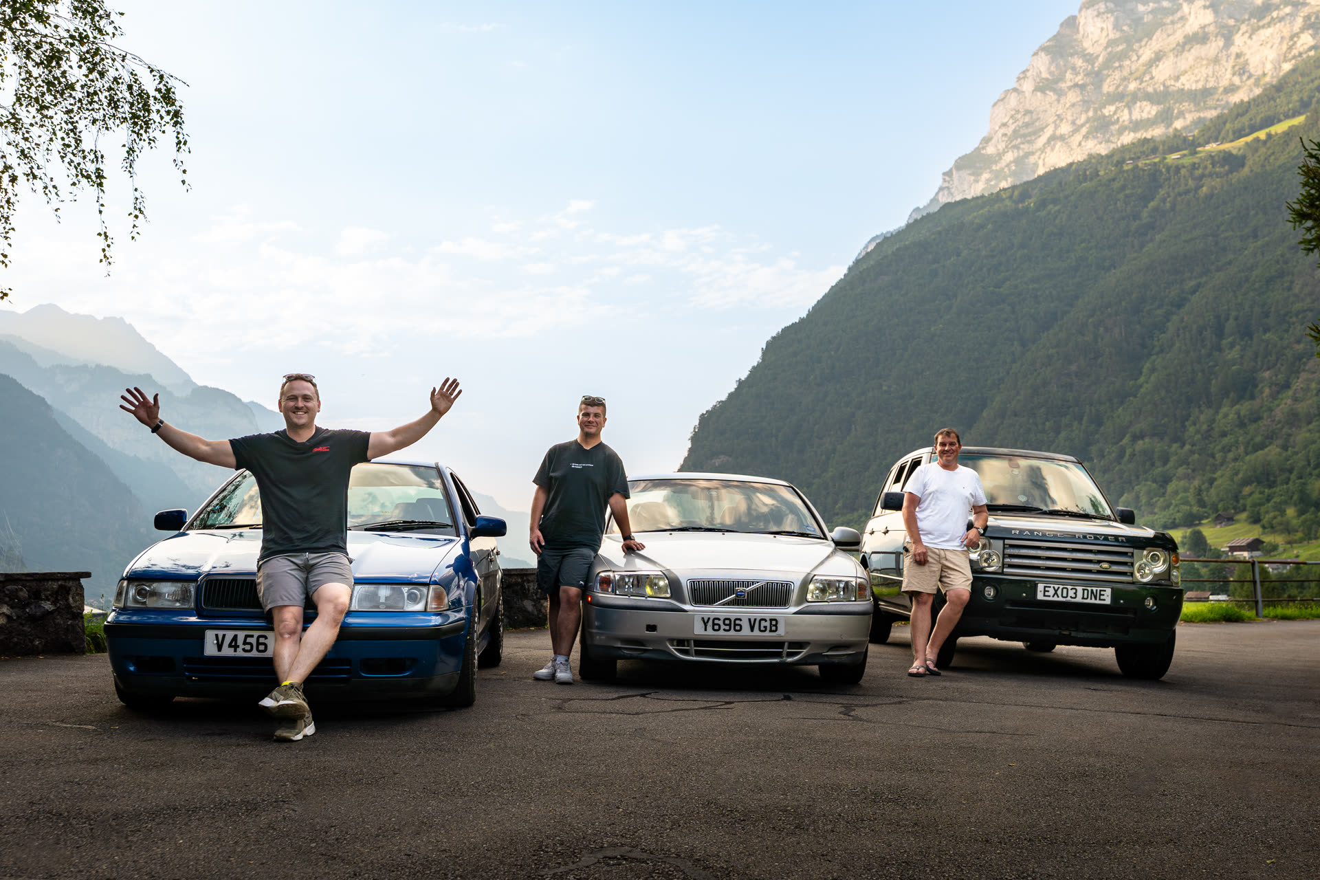 The AutoAlex team with two Volvos and a Range Rover on an alpine road trip